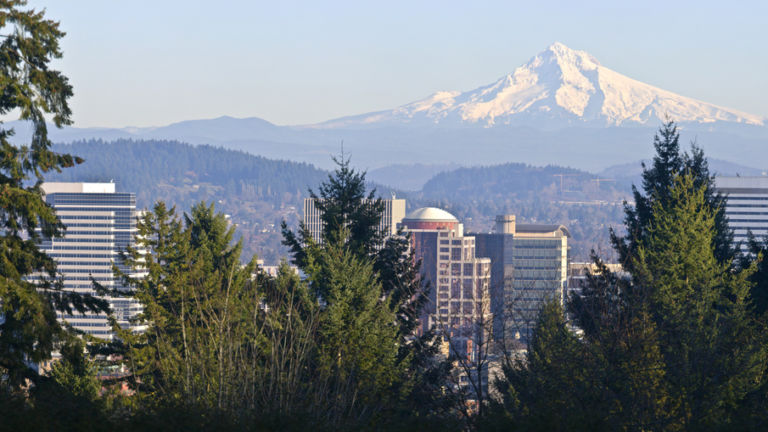 Mt. Hood panorama and downtown Portland Oregon buildings. Shutterstock