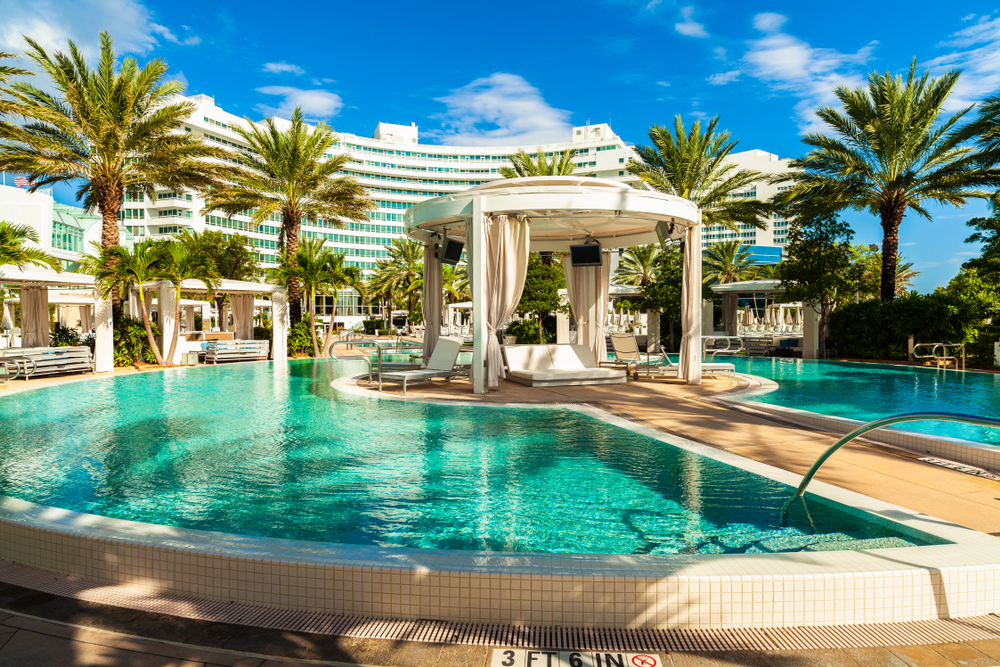 The Marvelous Music History of Miami Beach's Fontainebleau. The beautiful pool area of the historic art deco style Fontainebleau Hotel designed in the 1950s. Photo via Shutterstock.