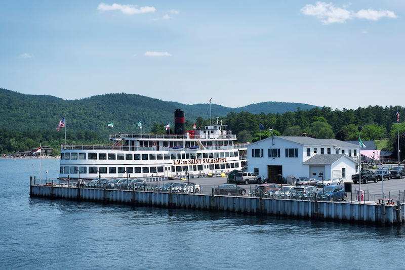 Lake George, New York. July 10, 2019. The historic lac du saint sacrement ferry docked on Lake George on a sunny summer blue sky day in New York. Photo via Shutterstock.