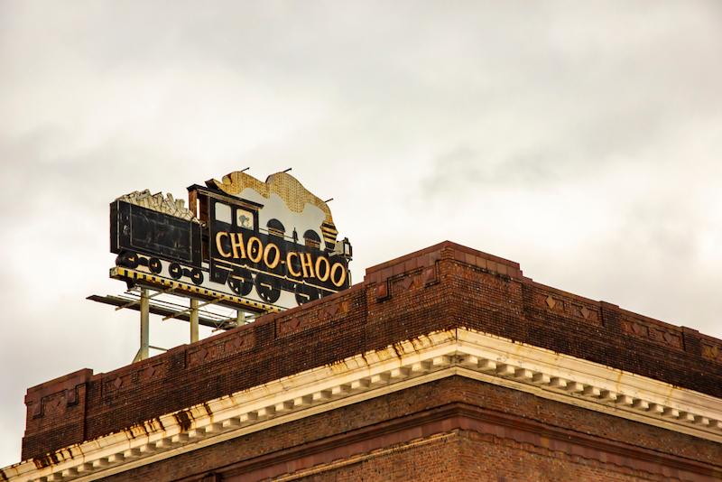 Sign for Chattanooga Choo Choo Hotel on top of landmark train station in Tennessee. Tennessee Whiskey Trail. Photo by Shutterstock.