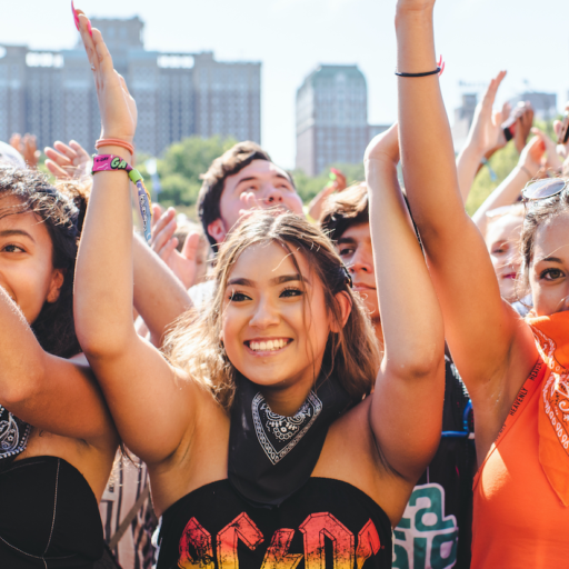 Chicago, Illinois - August 1st, 2019: Friends wait for a show to start at Lollapalooza in Grant Park, Chicago. Photo by Shutterstock.