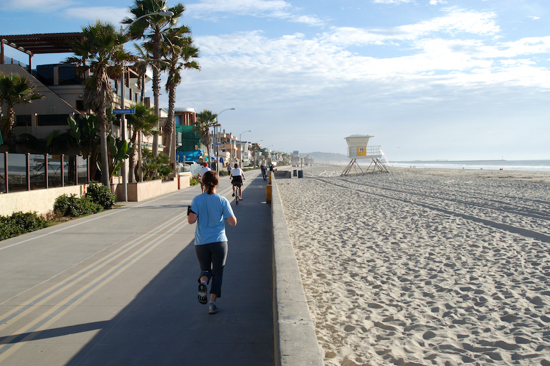 Joggers and cyclists on bicycle path and walkway along a beach; Mission Beach; San Diego, Calif. Photo by Shutterstock.