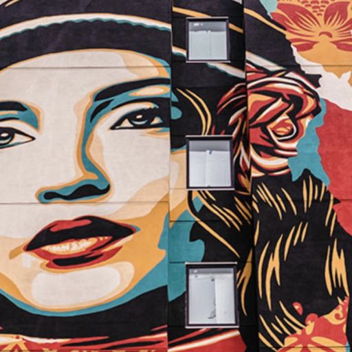 The Shepard Fairey five-story mural on the west side of the State Hotel.