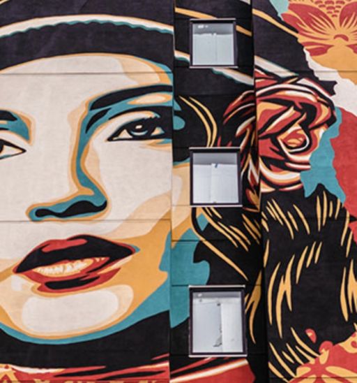 The Shepard Fairey five-story mural on the west side of the State Hotel.