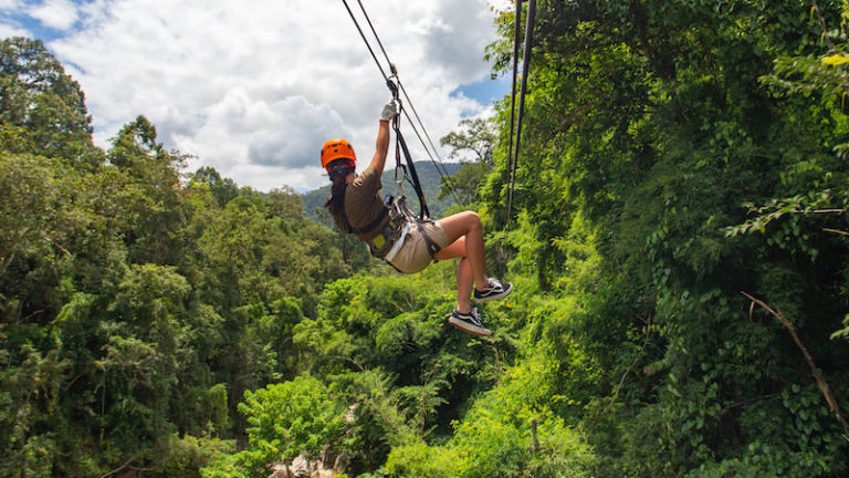 Ziplining fun that is NOT Adventureworks Zipline Forest but pretty darn similar. Photo via Shutterstock.