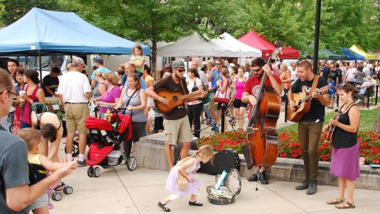 Madison WI - JULY 26th, 2014: Colorado music act "Rich With Friends" performs outside the Wisconsin State Capitol building during a regular Saturday Farmer's Market. Photo by Shutterstock.