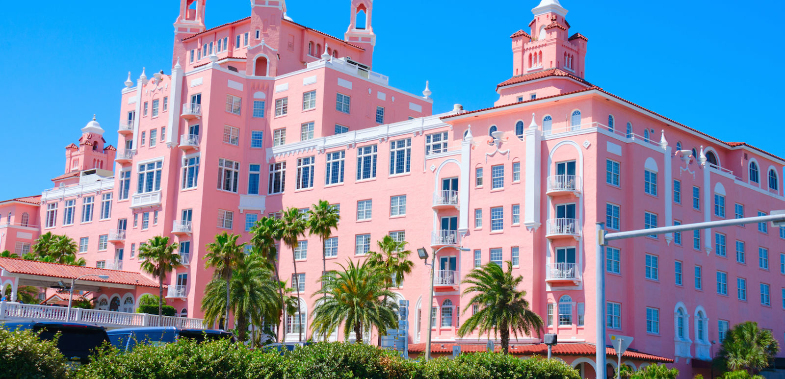 Saint Petersburg Beach, FL, USA - April 23, 2016: The Don Cesar Resort with palm trees on a cloudless sunny morning.