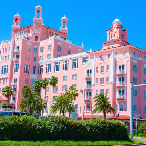 Saint Petersburg Beach, FL, USA - April 23, 2016: The Don Cesar Resort with palm trees on a cloudless sunny morning.
