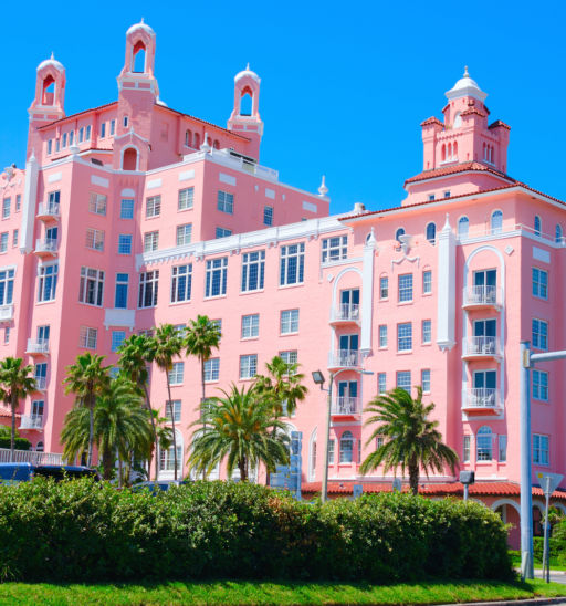 Saint Petersburg Beach, FL, USA - April 23, 2016: The Don Cesar Resort with palm trees on a cloudless sunny morning.
