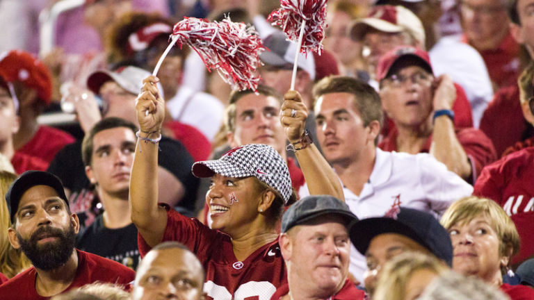 Alabama Crimson Tide fans at a football game. Photo via Shutterstock