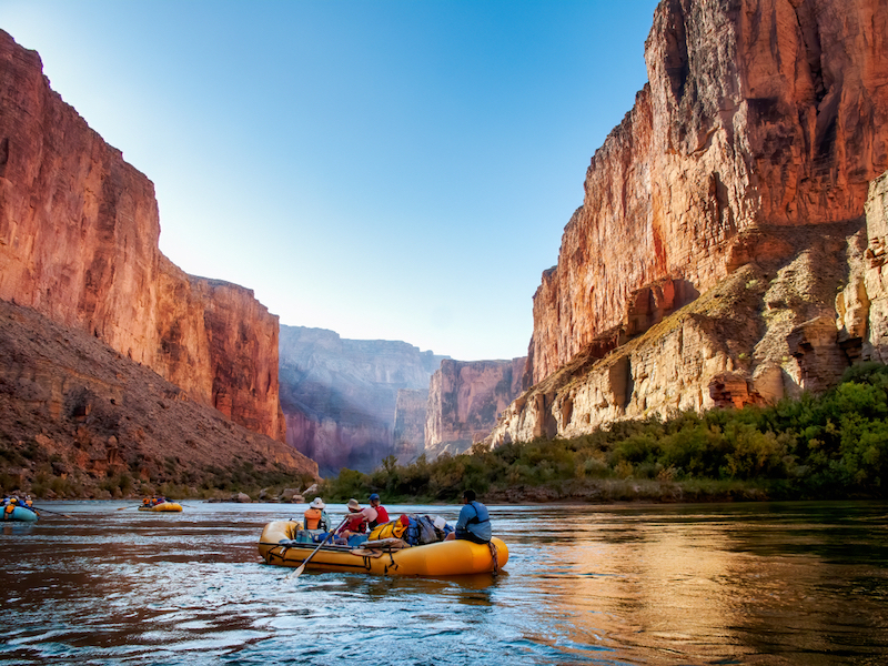 Rafting on The Colorado River in the Grand Canyon at sunrise. Photo by Shutterstock.