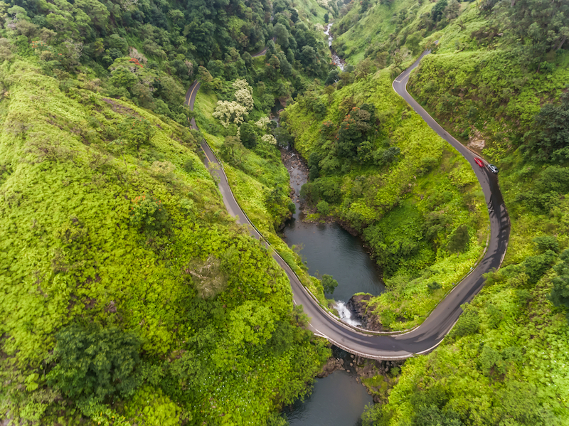 Aerial view of a waterfall on the road to Hana Maui Hawaii. Photo by Shutterstock.