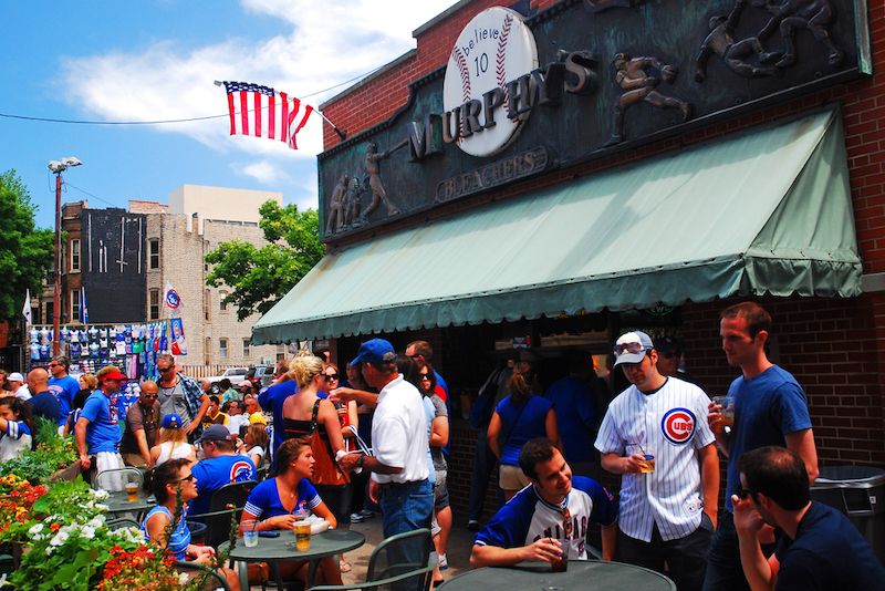 Fans celebrate a Cubs win at Murphy's, a tavern outside of Wrigley Field in Chicago. Photo by Shutterstock.