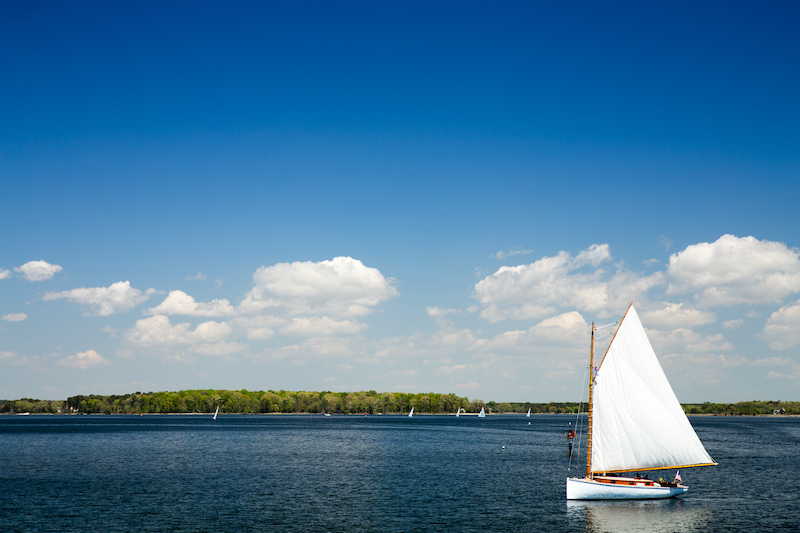 Sailboat viewed from the dock at the Chesapeake Bay Maritime Museum in St. Michael's, Maryland. Photo via Shutterstock.