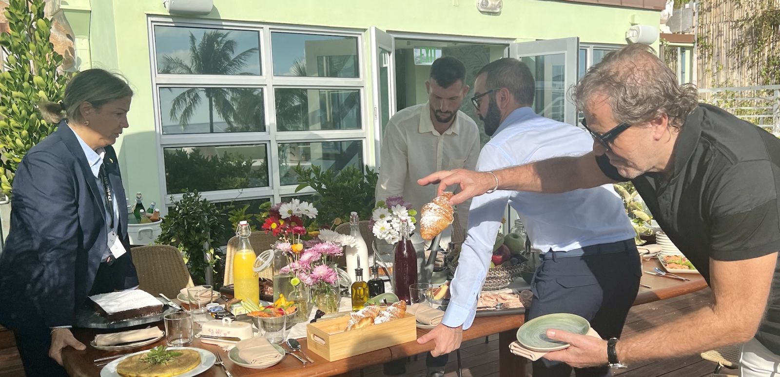 Billionaire Diesel founder Renzo Rosso plucks a cornetto from a moving breakfast table on the balcony of his Pelican Hotel penthouse. Photo by Adam Robb.