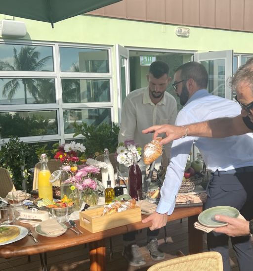 Billionaire Diesel founder Renzo Rosso plucks a cornetto from a moving breakfast table on the balcony of his Pelican Hotel penthouse. Photo by Adam Robb.