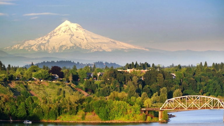 Portland Steel Bridge and Mt. Hood. Portland, Oregon. Photo via Shutterstock.