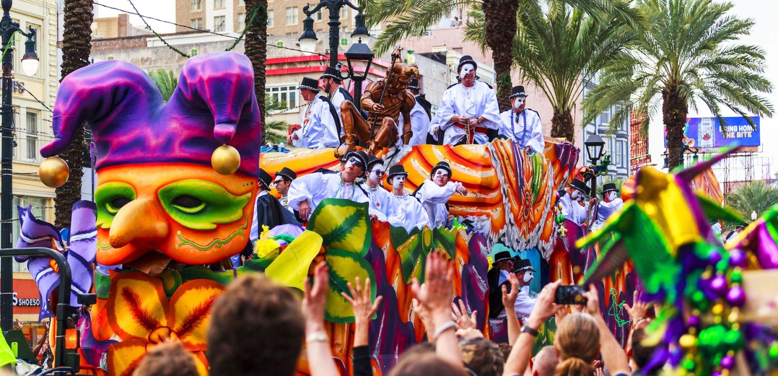 Mardi Gras parades through the streets of New Orleans. Photo via Shutterstock.