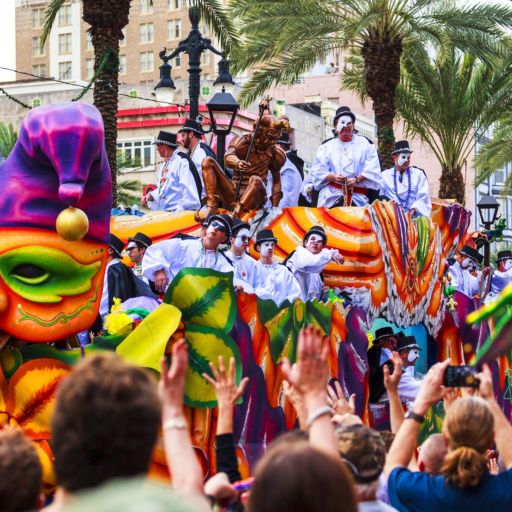 Mardi Gras parades through the streets of New Orleans. Photo via Shutterstock.