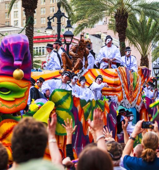 Mardi Gras parades through the streets of New Orleans. Photo via Shutterstock.