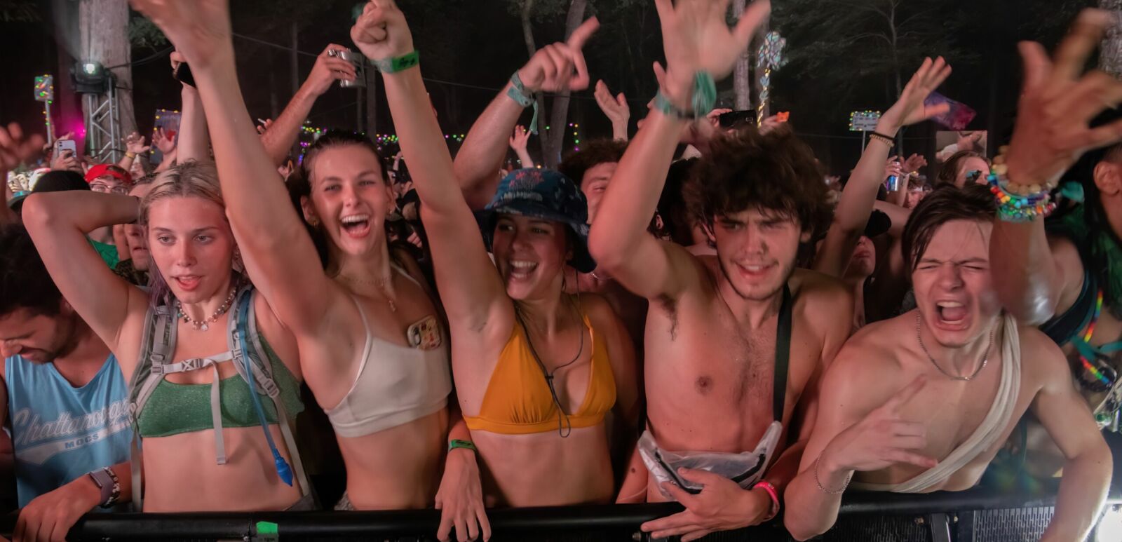 Manchester, Tennessee USA - 06-15-2022: EDM fans enjoying the music at Where In The Woods stage in Bonnaroo music festival campgrounds. Photo via Shutterstock.