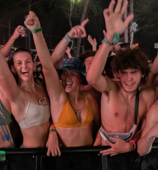 Manchester, Tennessee USA - 06-15-2022: EDM fans enjoying the music at Where In The Woods stage in Bonnaroo music festival campgrounds. Photo via Shutterstock.