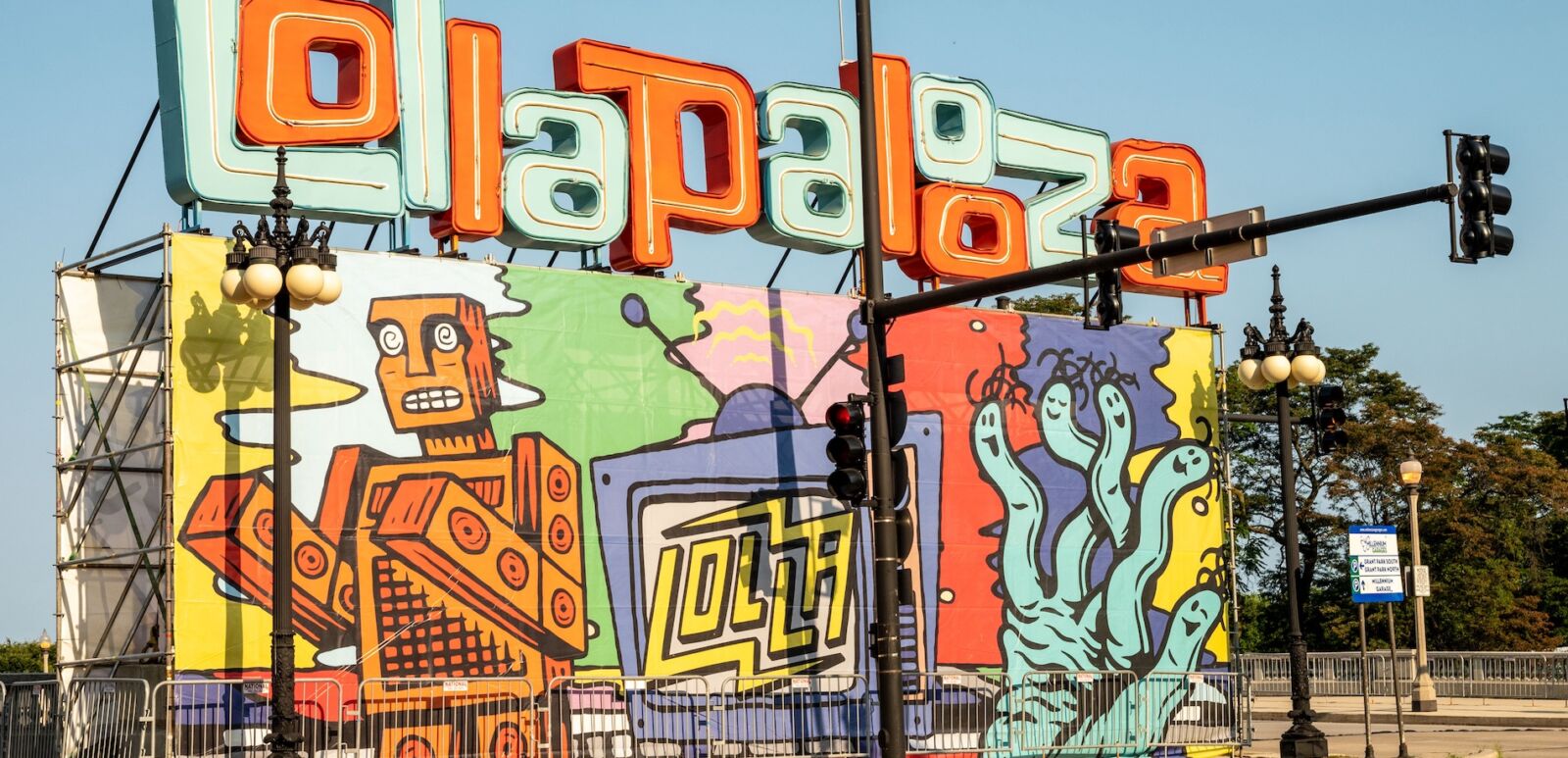 Chicago, IL - August 1, 2021: The temporary Lollapalooza sign downtown Chicago, at the entrance to Grant Park. Photo via Shutterstock.