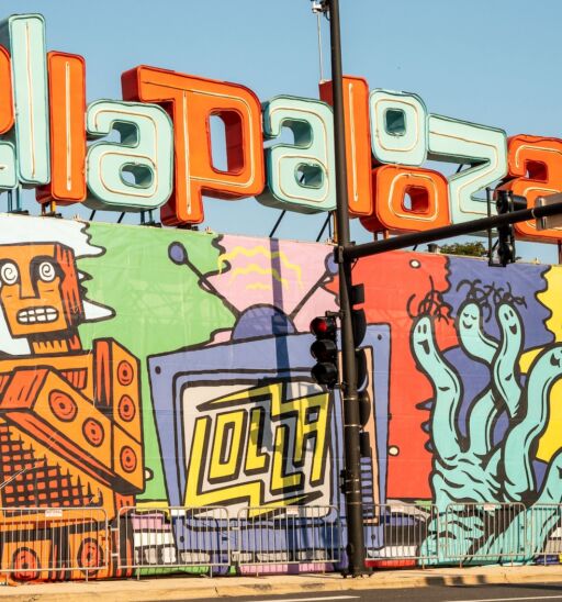 Chicago, IL - August 1, 2021: The temporary Lollapalooza sign downtown Chicago, at the entrance to Grant Park. Photo via Shutterstock.