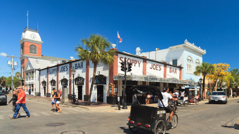 Best places for solo travel: Key West. The famous Sloppy Joe's Bar on Duval Street where American author and journalist Ernest Hemingway frequently attended on April 25, 2012 in Key West. Photo via Shutterstock.