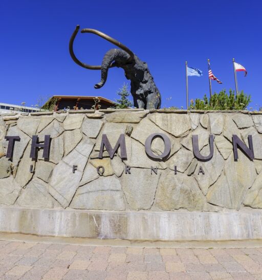 The mammoth statue in Mammoth Lake with blue sky. Photo via Shutterstock.