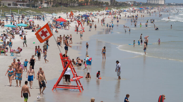 Crowds enjoying Jacksonville Beach on a weekend. Jacksonville Beach is 15 miles east of Jacksonville and has a population of 21,362 at the 2010 census.