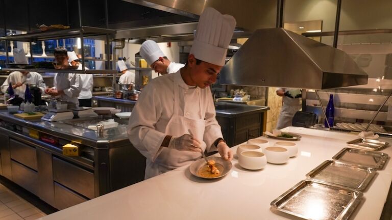 AUGUST 20, 2022: In kitchen of a Two Michelin Stars Jean-Georges restaurant by French chef Jean-Georges Vongerichten in Manhattan.