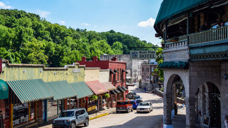 Eureka Springs, Arkansas, USA - July 5, 2021: Historic downtown Eureka Springs, AR, with boutique shops and famous buildings. Photo via Shutterstock.