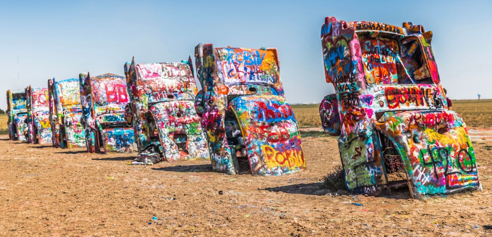 Cadillac Ranch is a public art installation and sculpture in Amarillo, Texas, USA. Photo via Shutterstock.