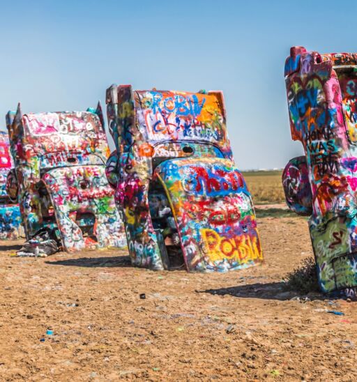Cadillac Ranch is a public art installation and sculpture in Amarillo, Texas, USA. Photo via Shutterstock.
