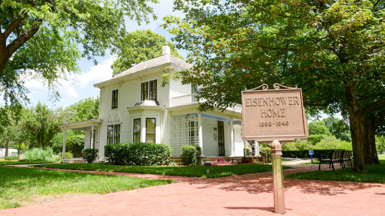 Abilene, Kansas, USA - July 9, 2019: The house where President Eisenhower used to live when it was a little boy is now an attraction. Photo via Shutterstock.