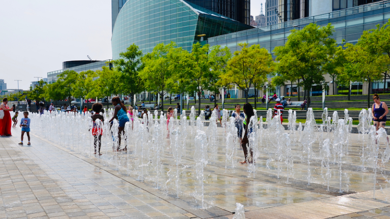 Detroit, Michigan, US- July 4, 2015: Detroit downtown riverside. People enjoying a sunny summer day on the America Independent holiday and celebration.