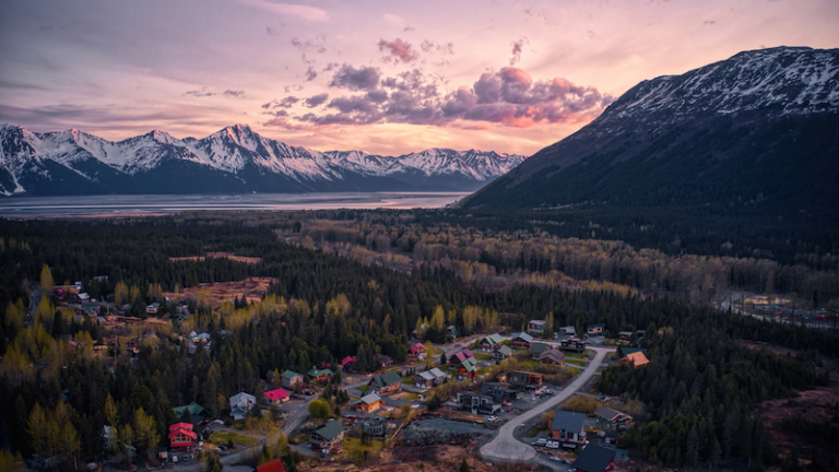 Aerial view of the resort town of Girdwood, Alaska at sunset.