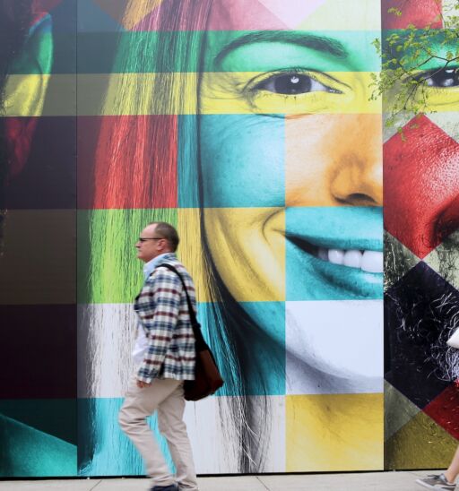 MAR 11, 2018: SXSW South by Southwest Annual music, film, and interactive conference and festival in Austin, Texas. Wall painted with colorful faces, symbolic for SXSW.