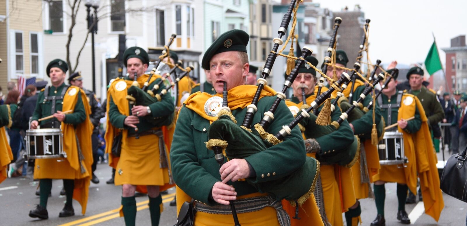 BOSTON, MASSACHUSETTS - MARCH 16: Irishmen in his kilt playing his bagpipe during the St. Patrick's Day Parade held March 16, 2008. The event was held in Boston, Massachusetts. Photo via Shutterstock.