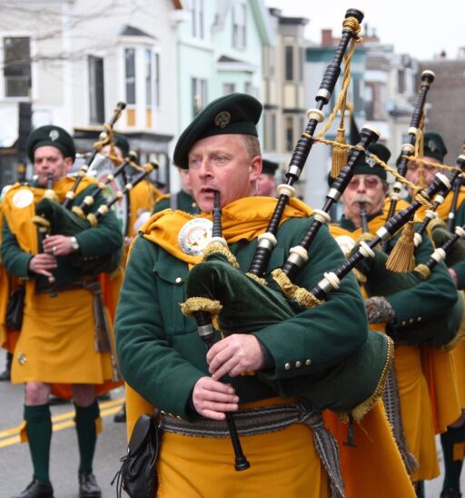 BOSTON, MASSACHUSETTS - MARCH 16: Irishmen in his kilt playing his bagpipe during the St. Patrick's Day Parade held March 16, 2008. The event was held in Boston, Massachusetts. Photo via Shutterstock.