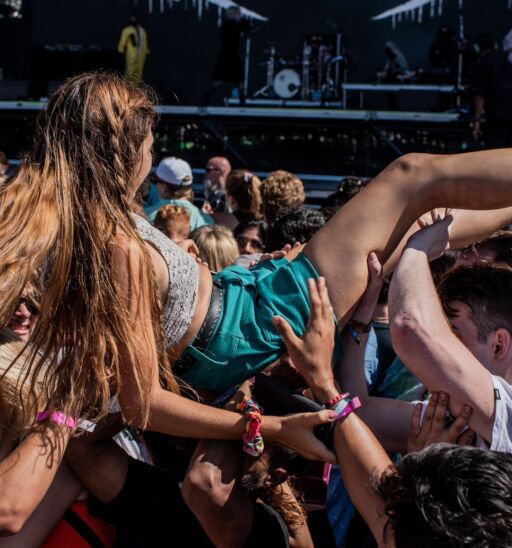 A fan crowd surfs during Ghostemane's performance at Lollapalooza in Grant Park, Chicago.