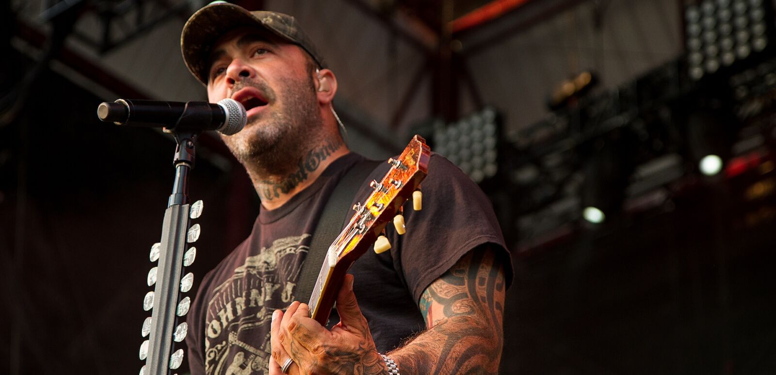 Aaron Lewis plays his guitar during a performance of Staind.