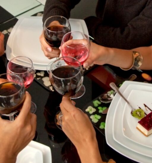 People enjoying food and wine.