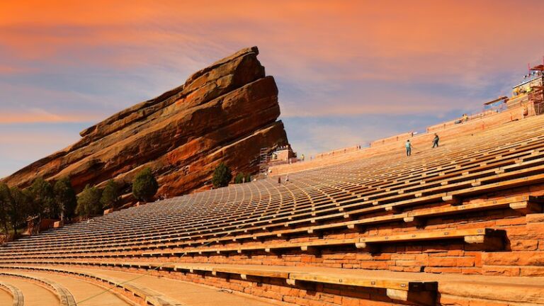 Curved benches at Red Rocks Amphitheatre in Denver Colorado. Red Rocks Amphitheatre is one of the world's best concert venues. Photo via Shutterstock.